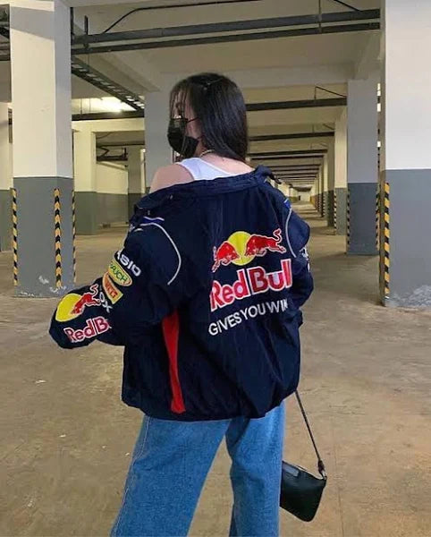 Back view of Red Bull Racing jacket showing 'Gives You Wings' slogan in bold text